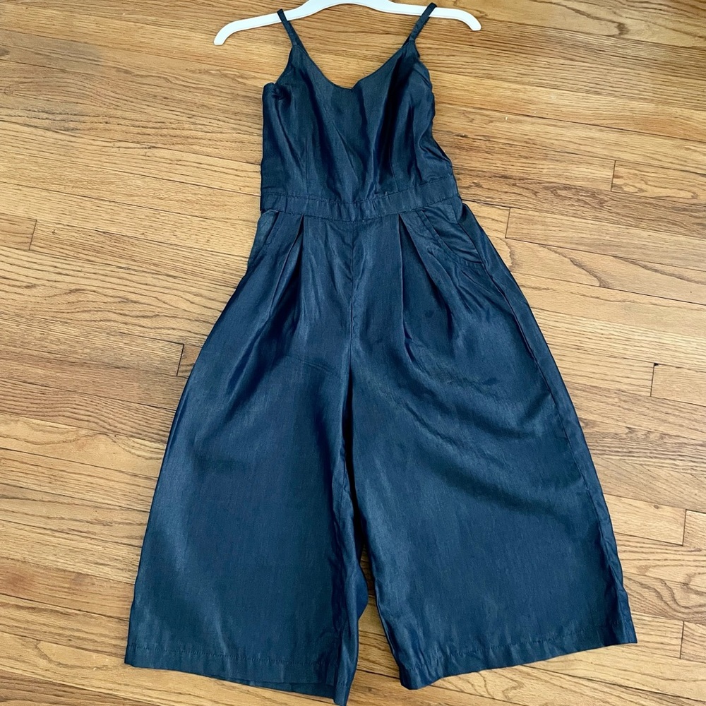 One-of-a-kind denim romper w/pockets. Made in Senegal